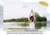 a woman is doing yoga in front of a lake