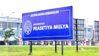 a large billboard advertising the university of prastitiya mulya