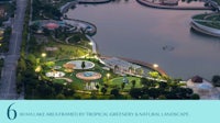 an aerial view of a park with a lake and a playground