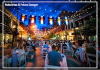 a street scene with people sitting at tables at night