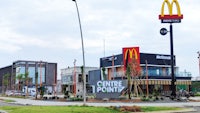 a mcdonald's restaurant on the corner of a street