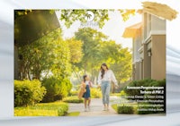 a woman and a child walking down a street in front of a house