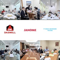 a group of people sitting around a table in a conference room