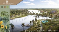 an aerial view of a resort with a lake and trees