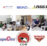 a group of people sitting at a table with logos