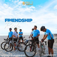 a group of cyclists on a beach with the words friendship ride