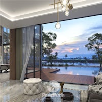 a modern living room with large windows overlooking a lake