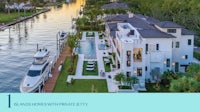 a house with a boat docked in front of it